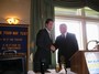Jim Johnson receives the Rotary-Chamber Business Person of the Year Award with Brian Kolb presenting